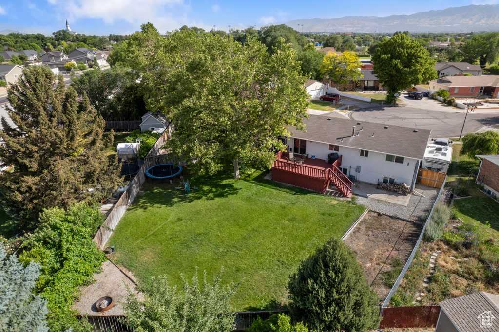 Aerial perspective of suburban area with a mountain backdrop