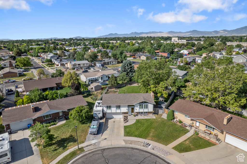 Aerial view of residential area featuring mountains