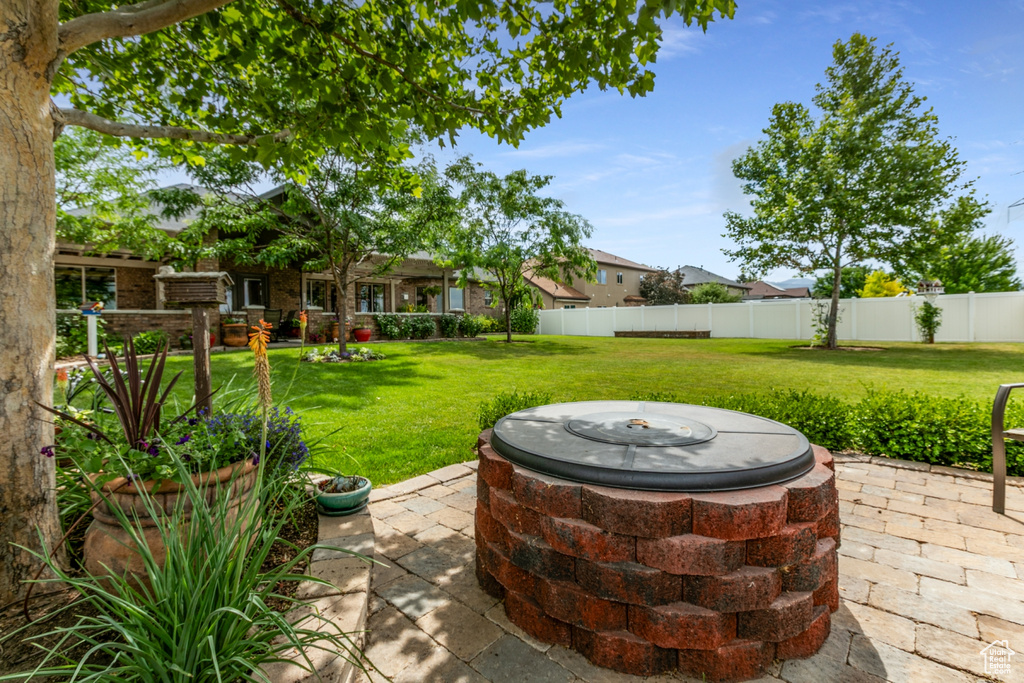 View of patio featuring an outdoor fire pit