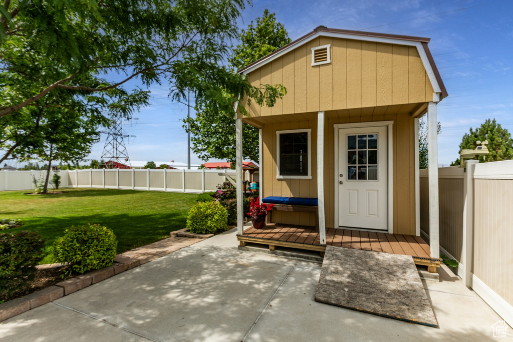 View of outbuilding with a fenced backyard