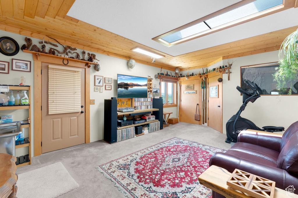 Living area with carpet and wood ceiling