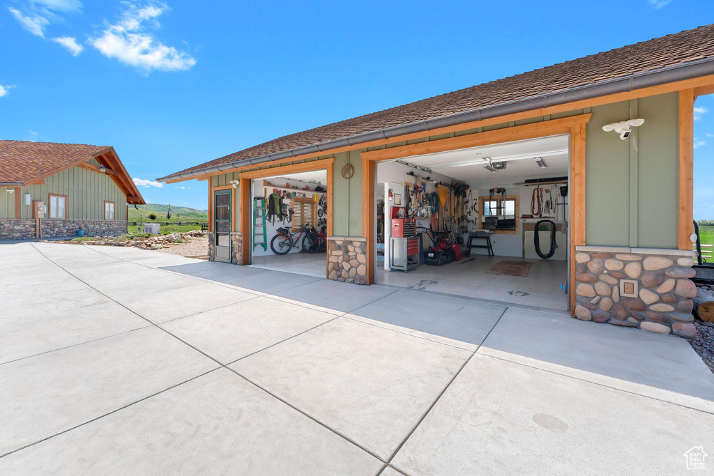 Garage featuring driveway