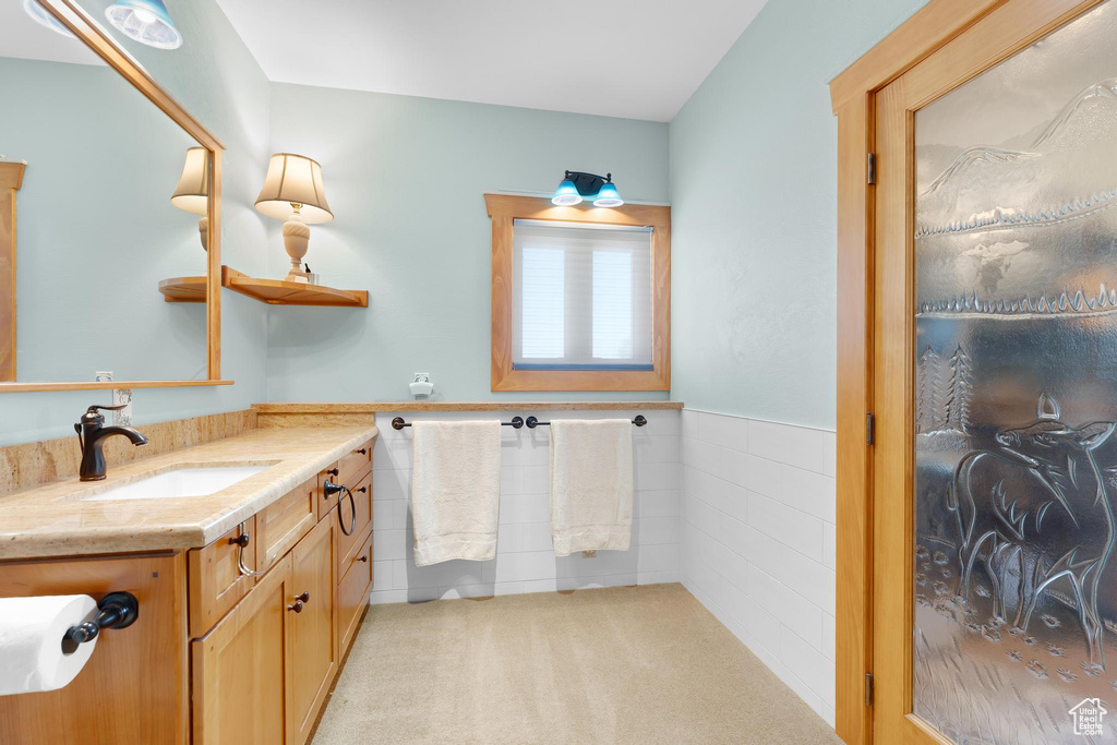 Bathroom featuring vanity and wainscoting