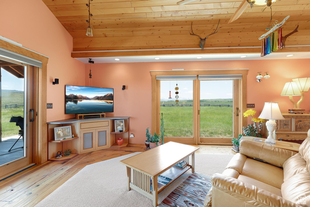 Living room with wooden ceiling, hardwood / wood-style flooring, lofted ceiling, and recessed lighting