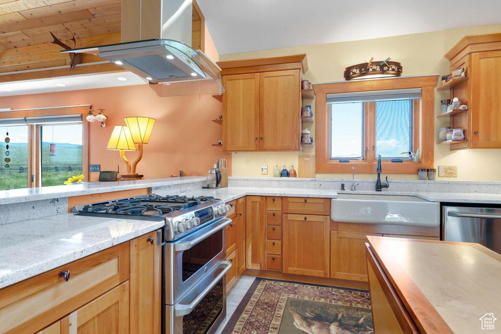 Kitchen with appliances with stainless steel finishes, island exhaust hood, open shelves, light stone countertops, and wood ceiling