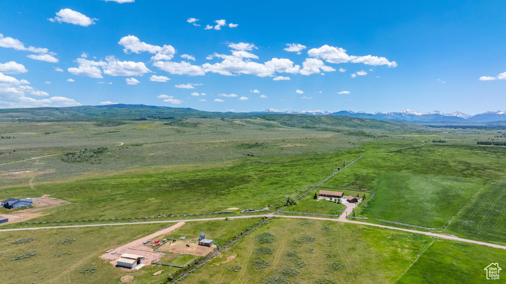 Aerial view of sparsely populated area featuring a mountain backdrop
