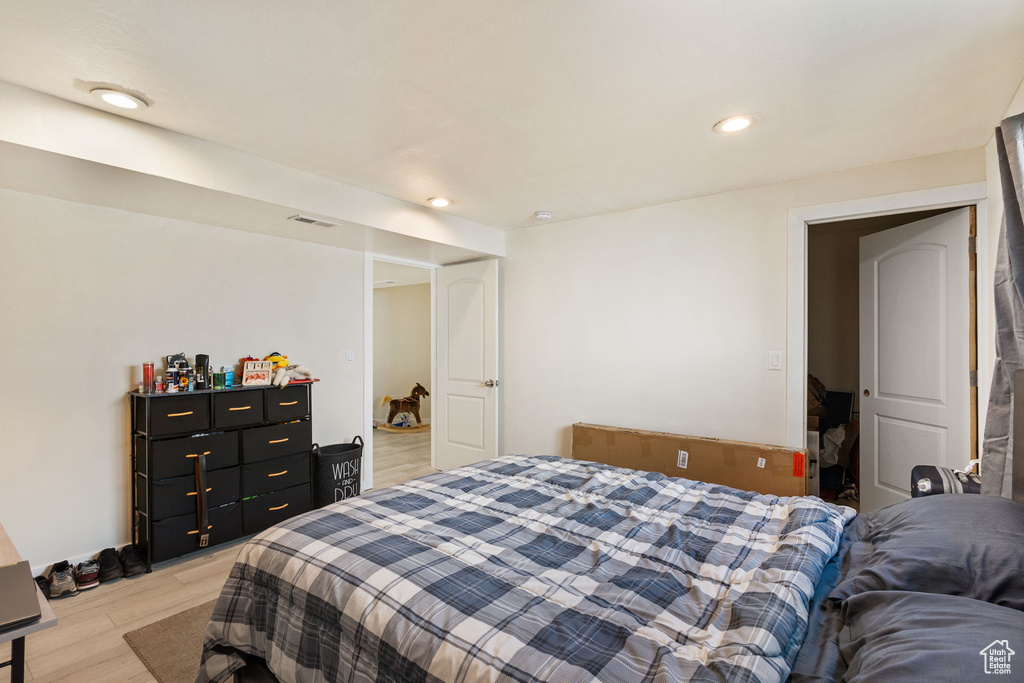 Bedroom featuring light wood-style floors and recessed lighting