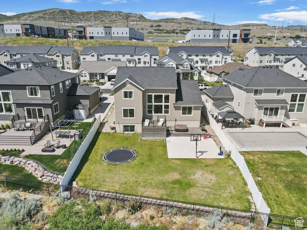Aerial perspective of suburban area featuring a mountainous background