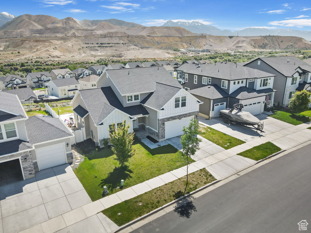 Aerial perspective of suburban area featuring a mountain backdrop