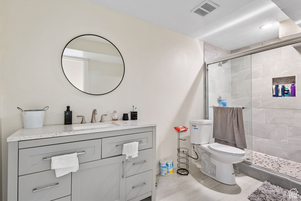Full bath with vanity and a stall shower