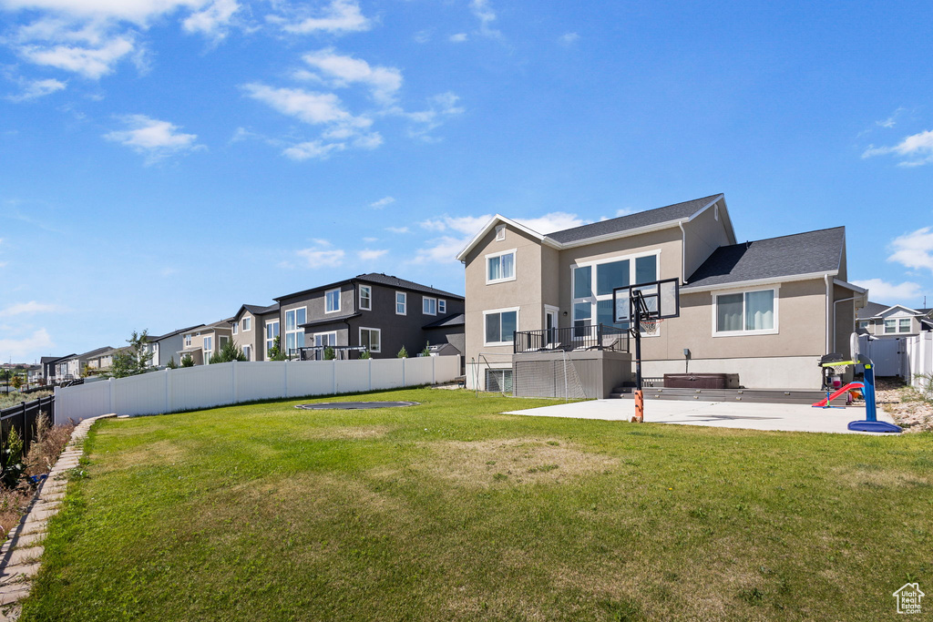 Back of house with a residential view, a patio, a fenced backyard, stucco siding, and roof with shingles