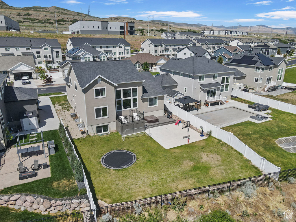 Aerial perspective of suburban area featuring a mountainous background