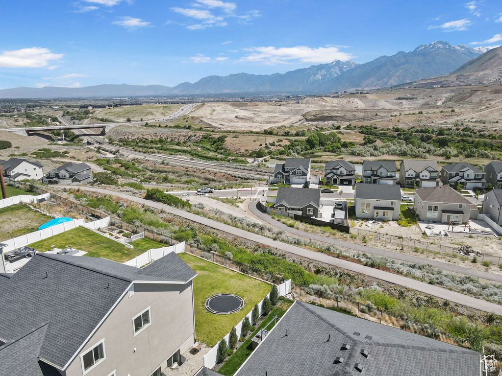 Aerial perspective of suburban area featuring a mountain backdrop