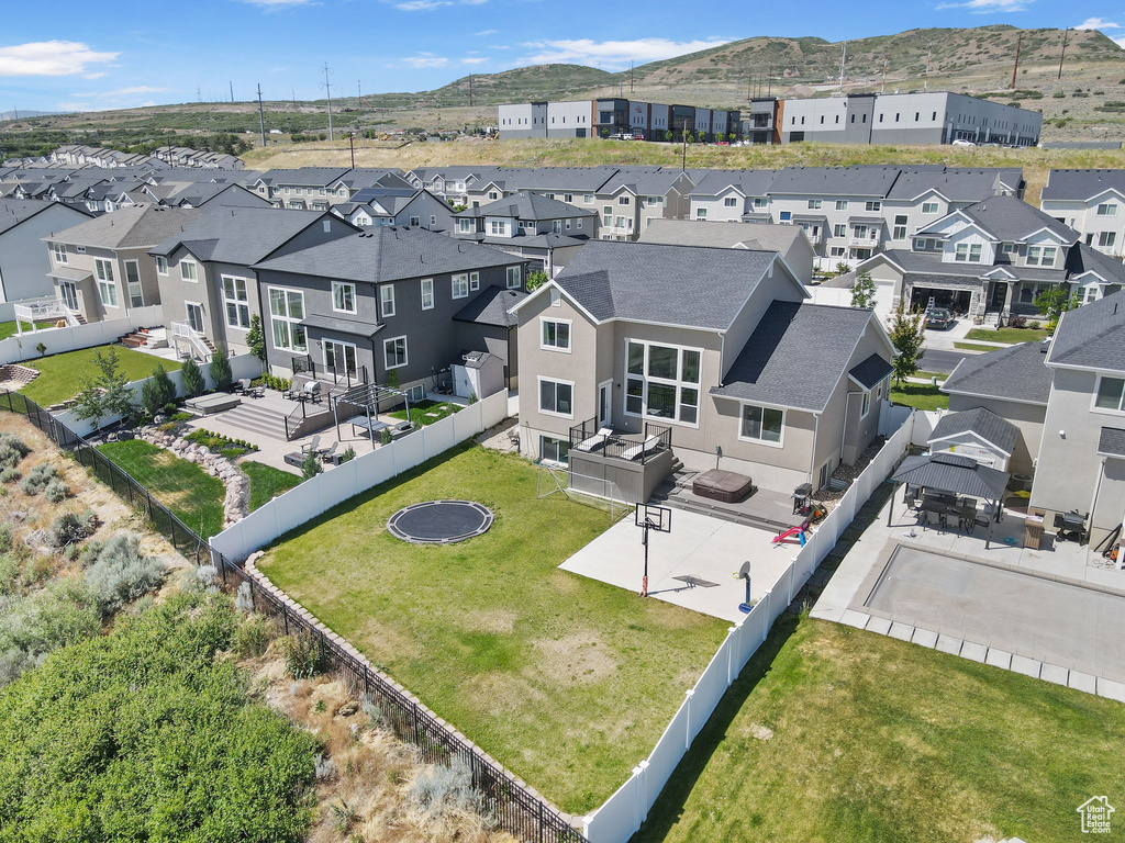 Aerial view of residential area featuring mountains