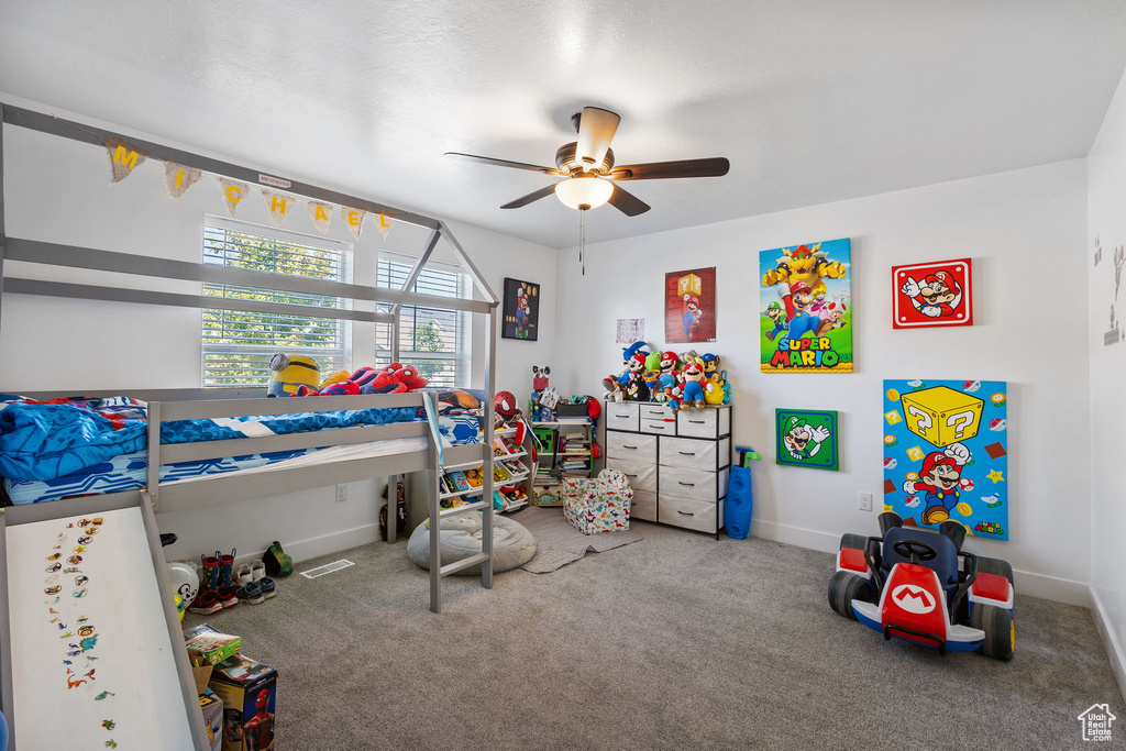 Bedroom with carpet flooring and a ceiling fan