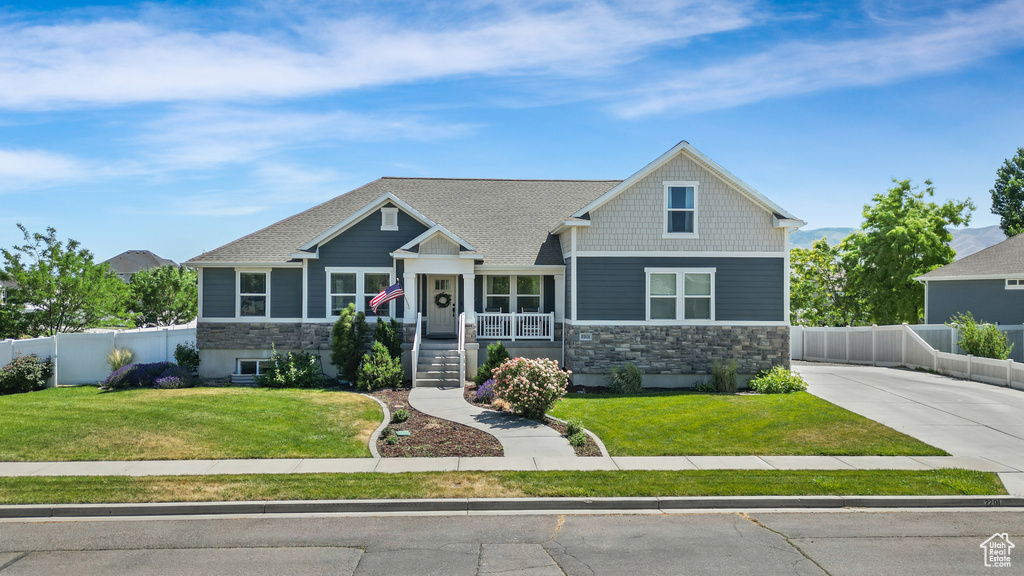 Craftsman-style home with stone siding