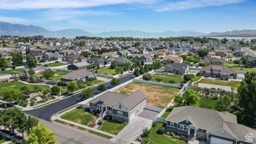 Aerial perspective of suburban area featuring a mountainous background
