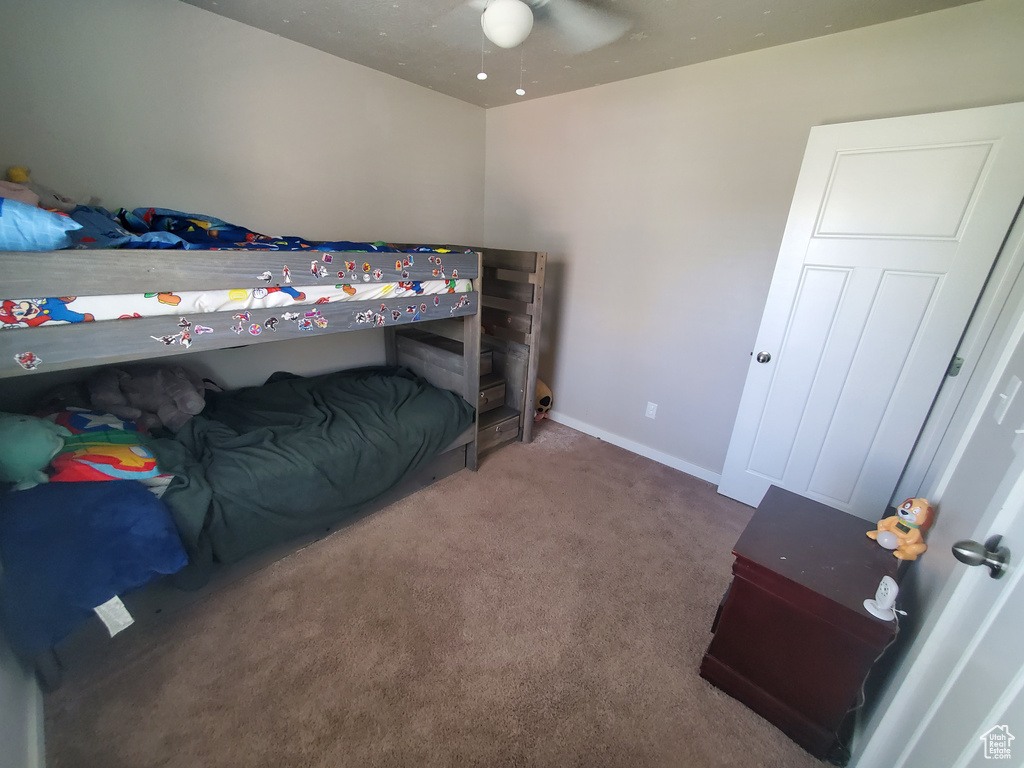 Carpeted bedroom with baseboards