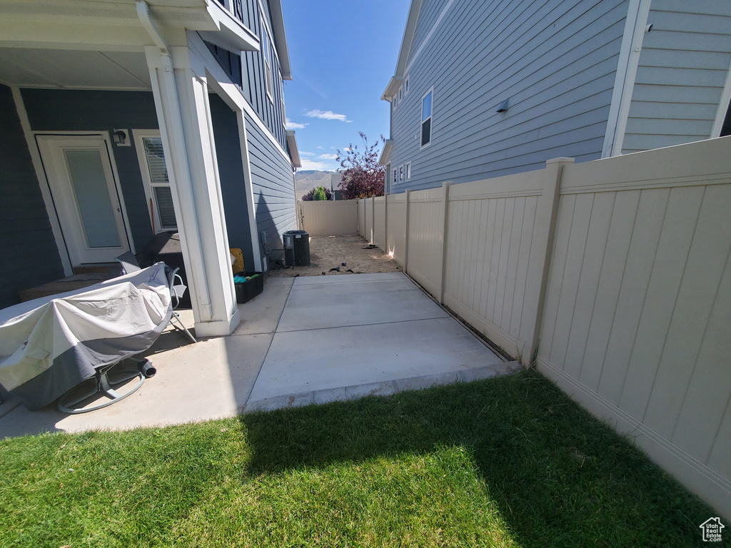 Fenced backyard featuring a patio