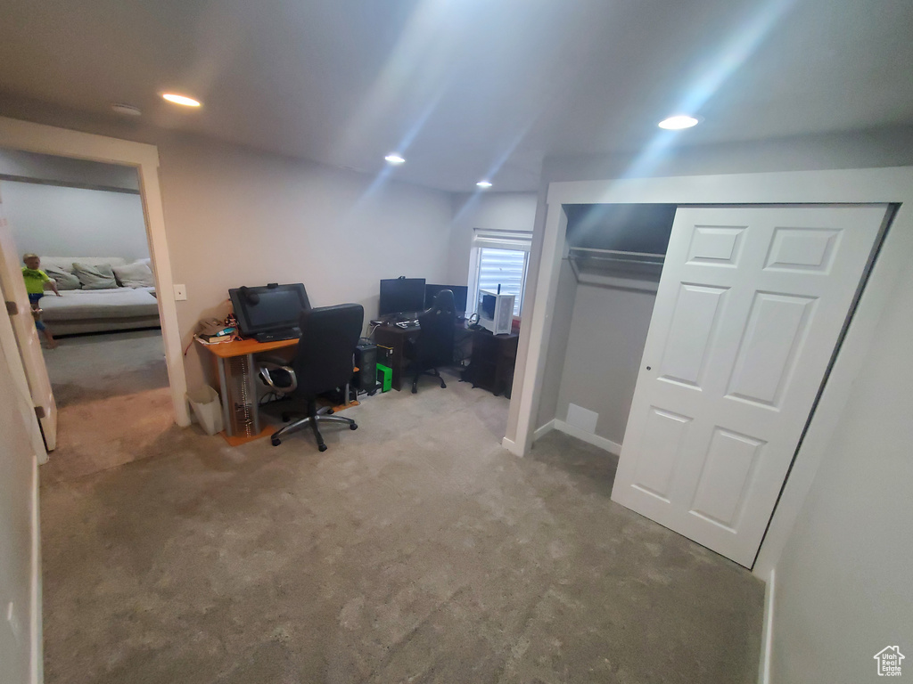 Office space with carpet and recessed lighting