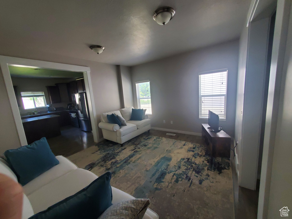 Living room with baseboards and wood finished floors