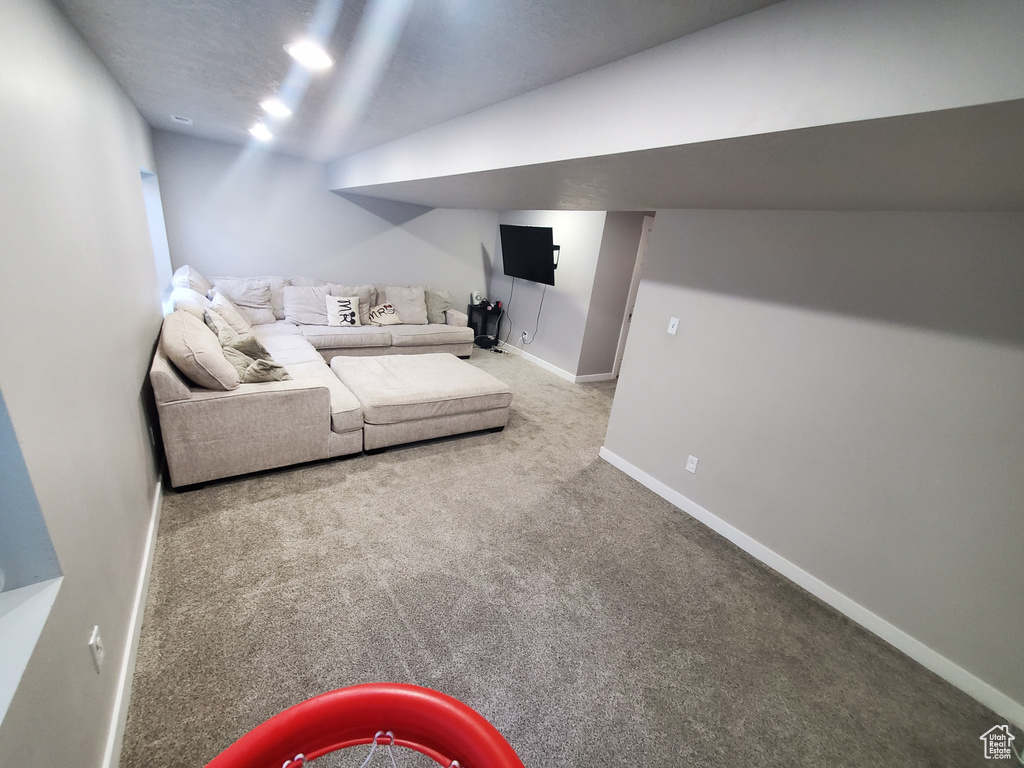 Living area with carpet flooring and baseboards