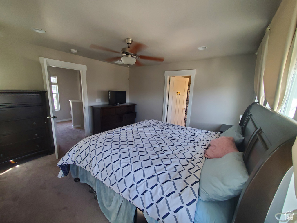 Bedroom with carpet flooring, a ceiling fan, and recessed lighting