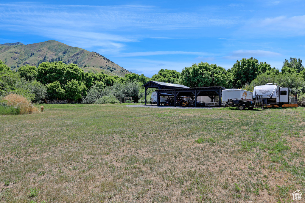 View of green lawn with a mountain view