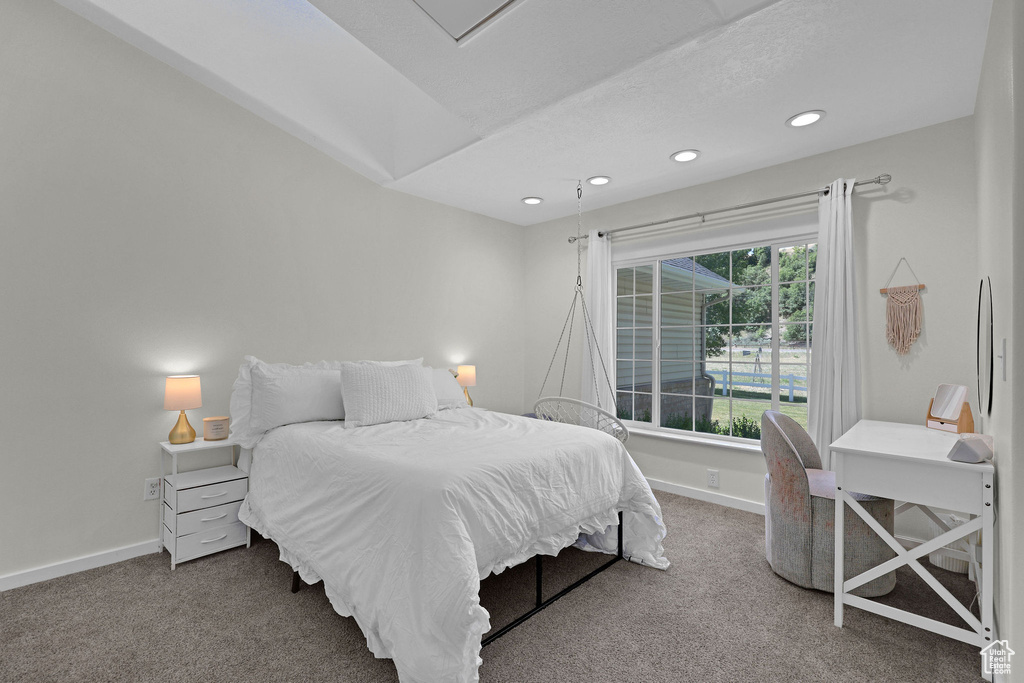 Carpeted bedroom featuring recessed lighting and baseboards