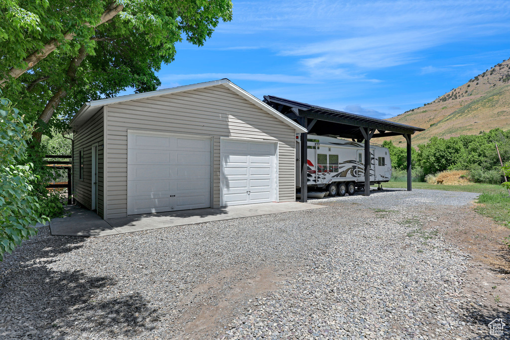Detached garage featuring a mountain view