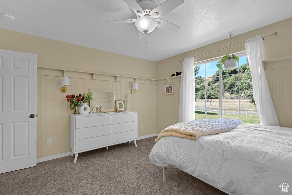 Bedroom with carpet flooring and ceiling fan