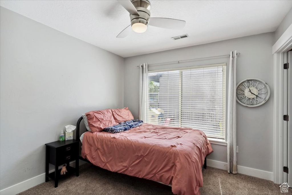 Bedroom with carpet floors and ceiling fan