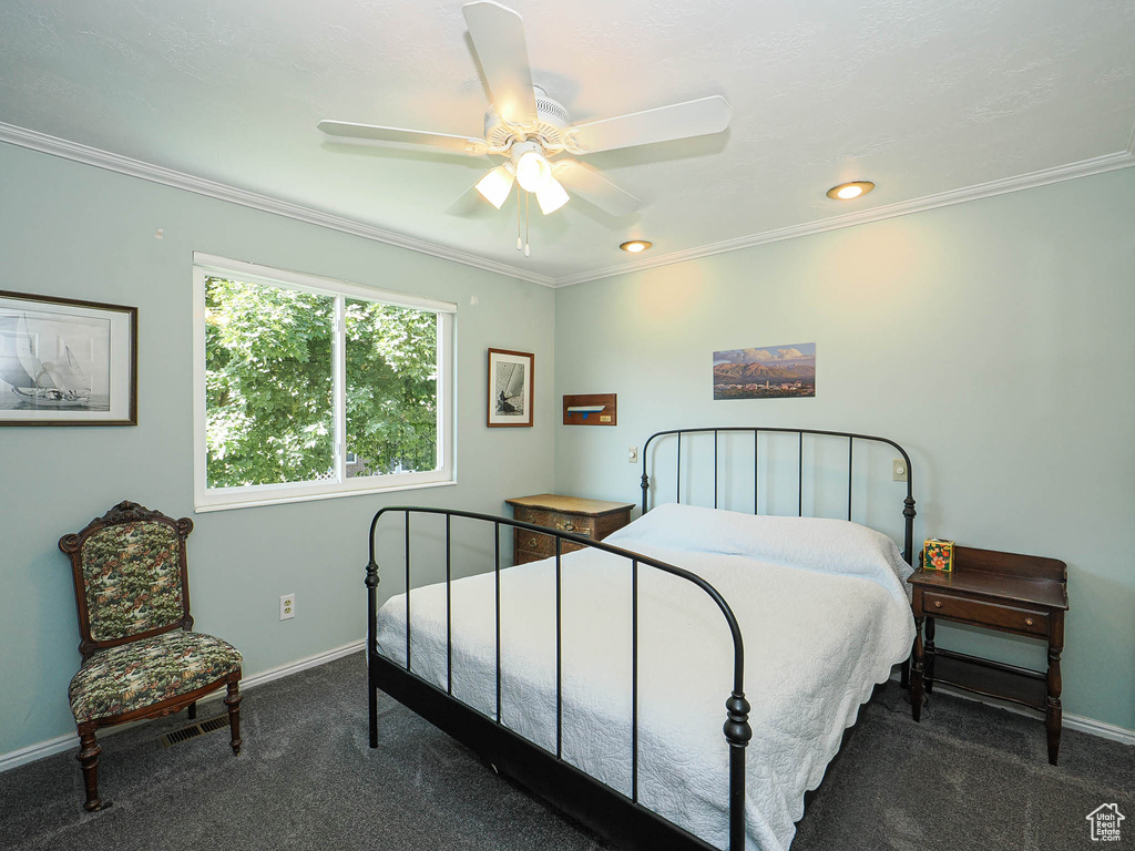 Bedroom with carpet floors, ornamental molding, ceiling fan, and recessed lighting