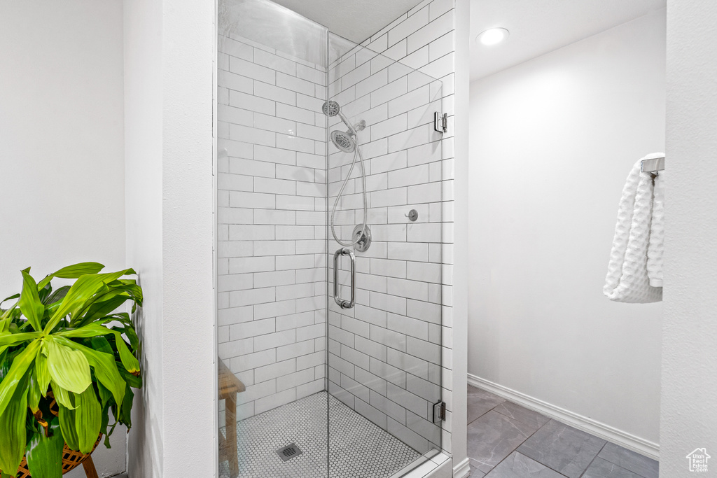 Full bathroom with a stall shower and recessed lighting