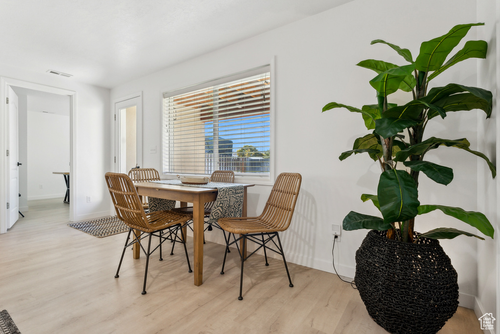 Dining area with wood finished floors and baseboards