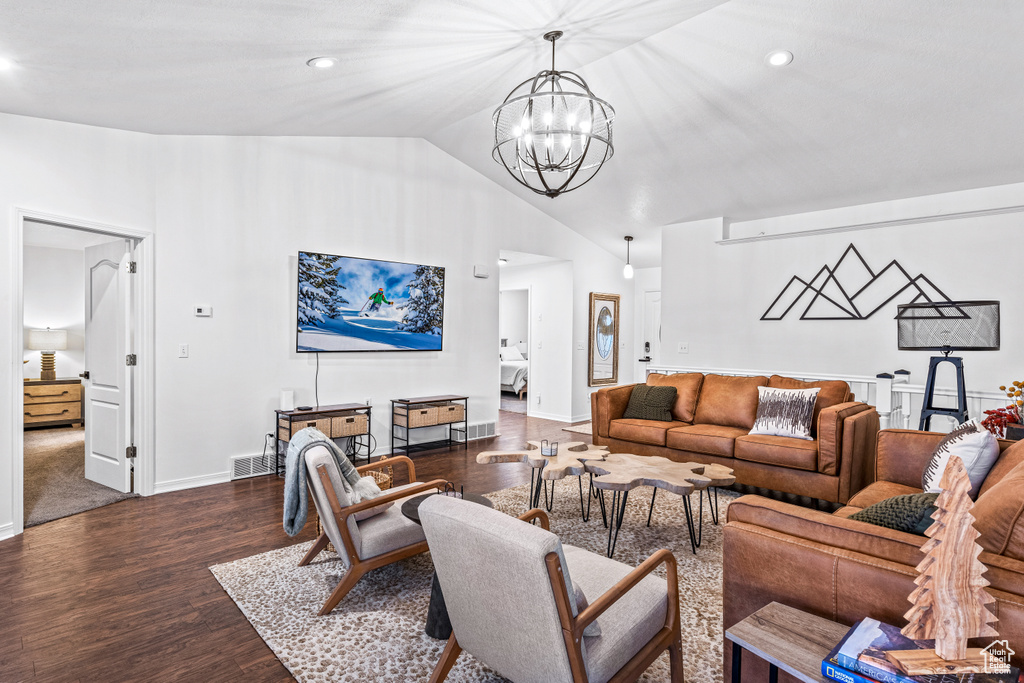 Living area featuring a chandelier, dark wood finished floors, recessed lighting, and high vaulted ceiling