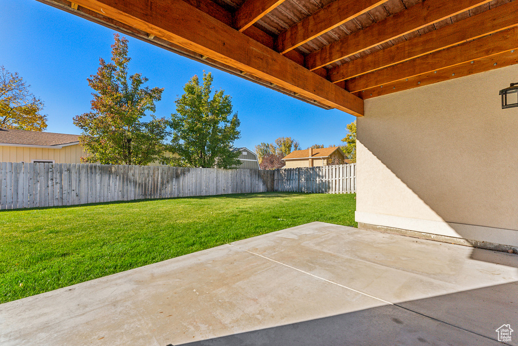 Fenced backyard featuring a patio