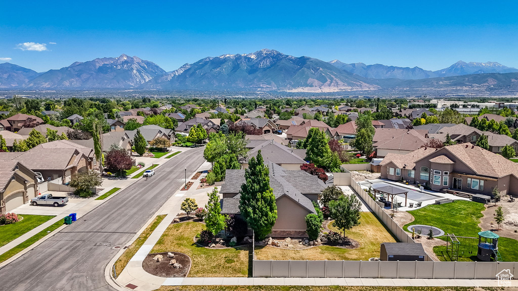 Aerial view of residential area with a mountainous background