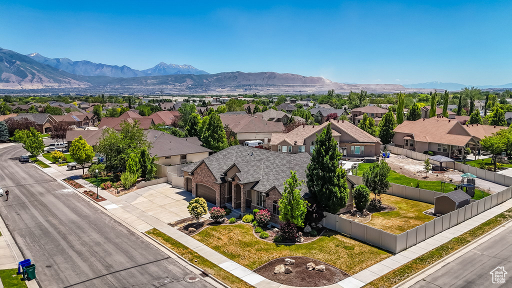 Aerial perspective of suburban area with a mountain backdrop