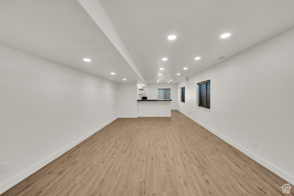 Unfurnished living room with recessed lighting and light wood finished floors
