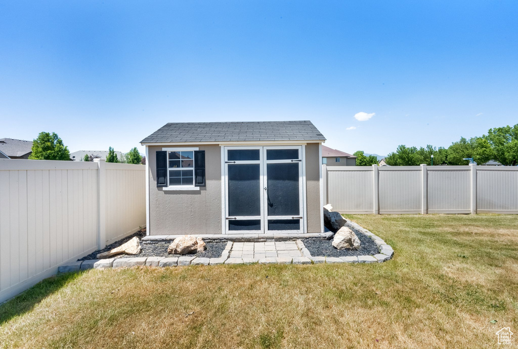 View of shed featuring a fenced backyard