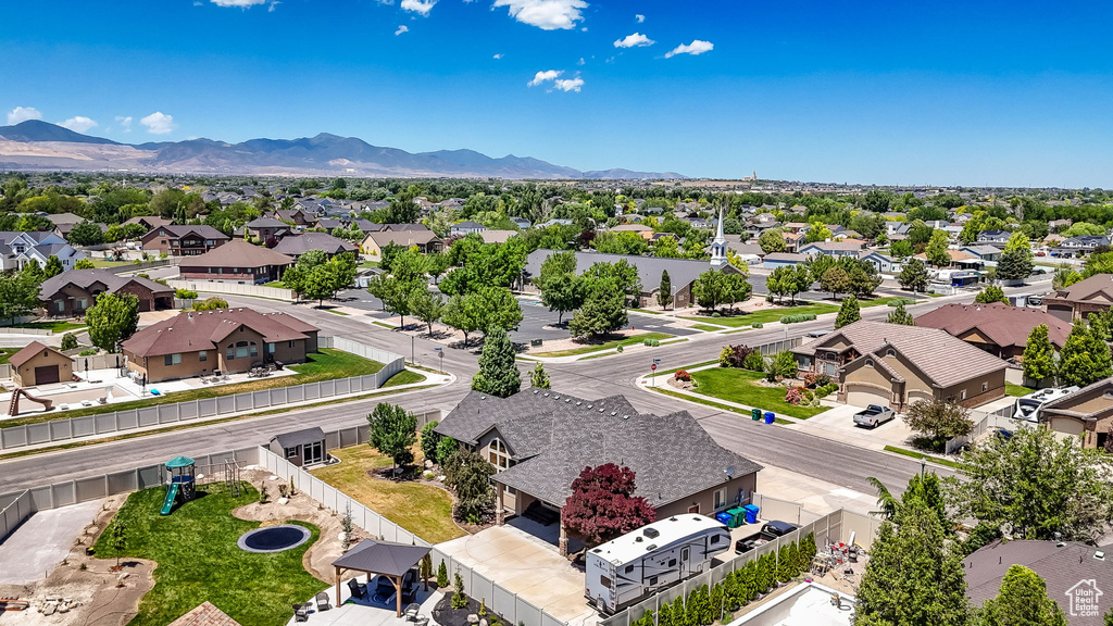 Aerial view of residential area featuring a mountain backdrop