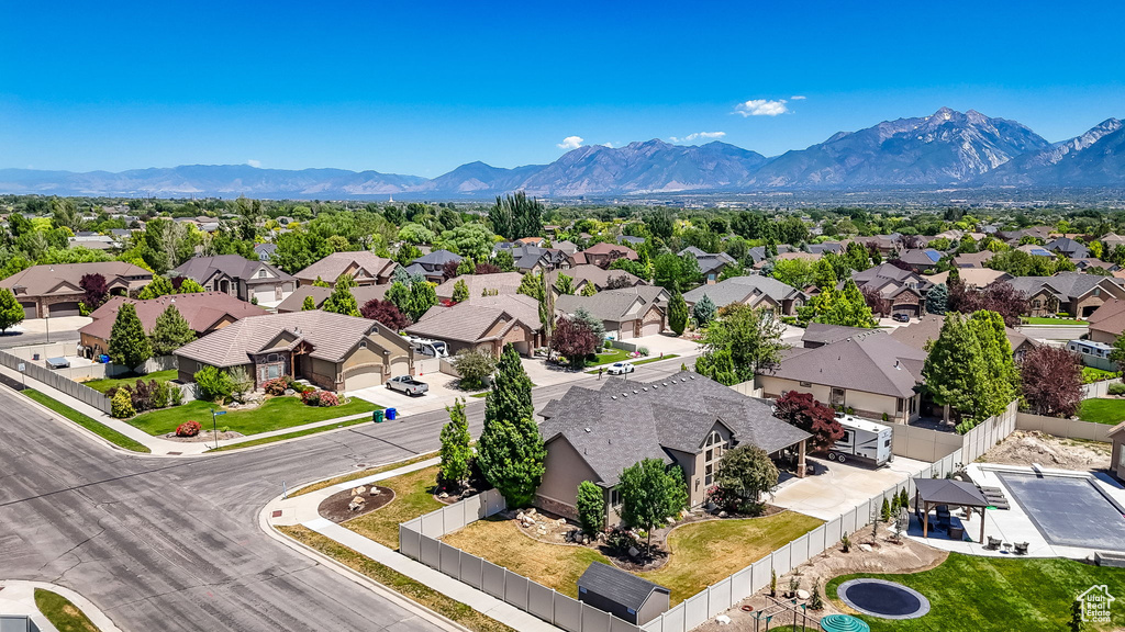 Aerial view of residential area featuring mountains