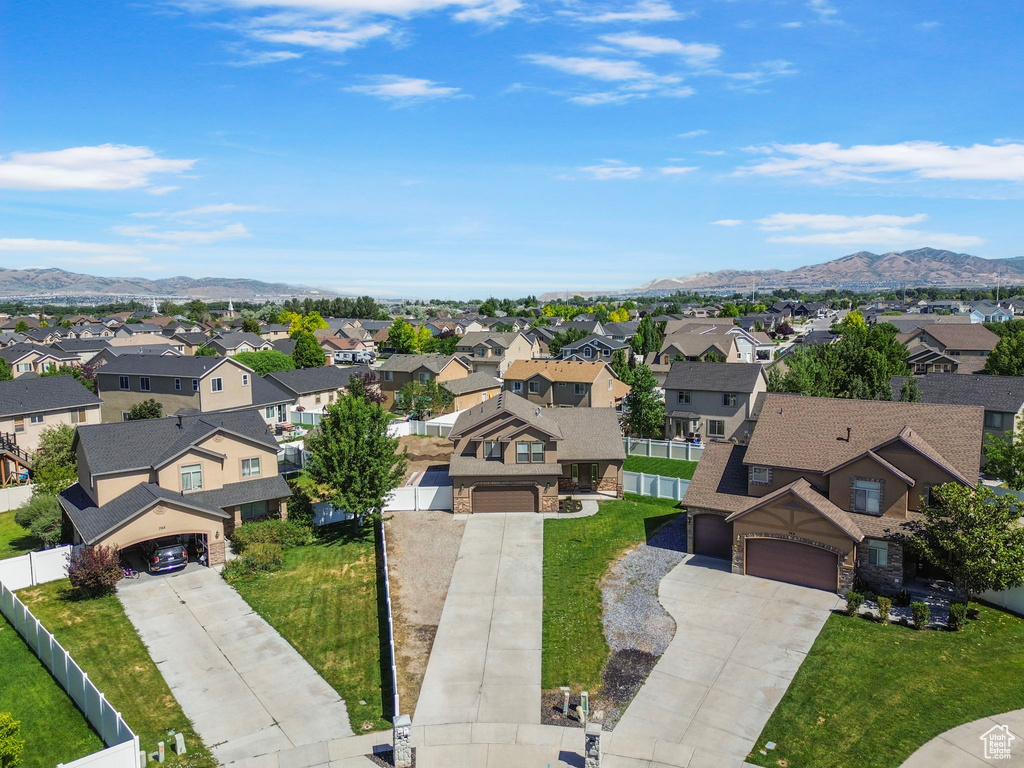Aerial perspective of suburban area with a mountain backdrop
