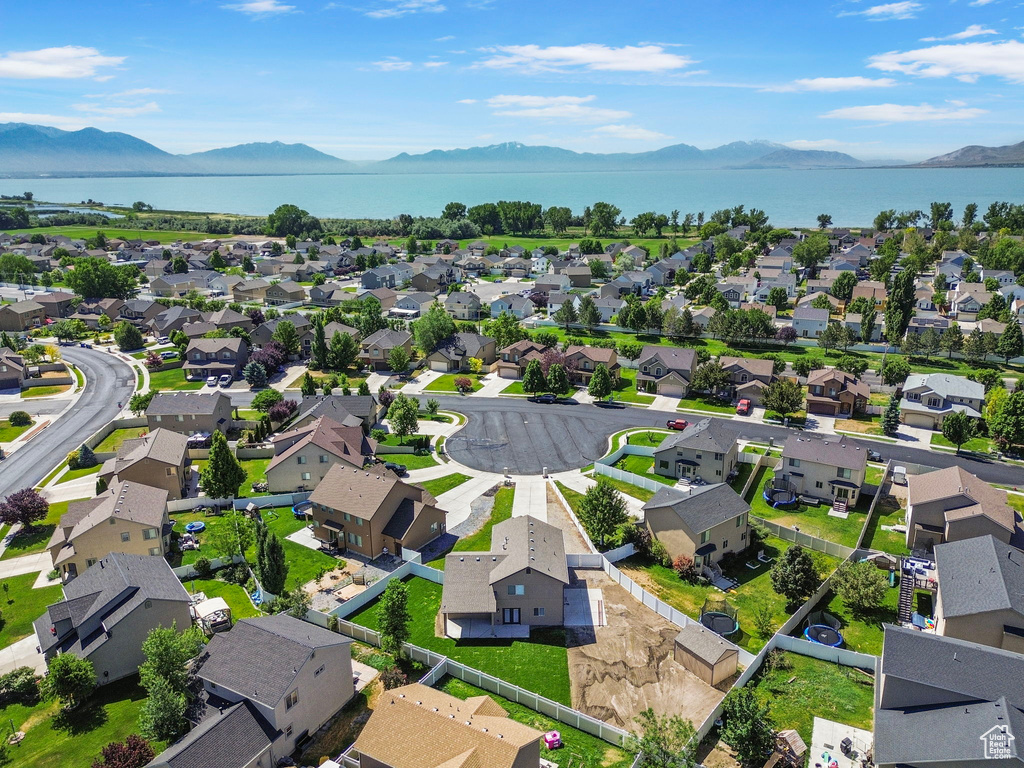 Aerial view of residential area featuring a water and mountain view