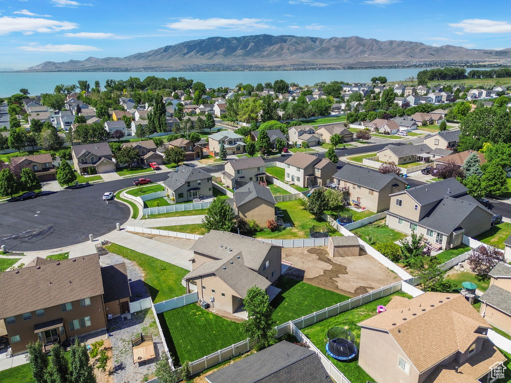 Aerial view of residential area featuring a water and mountain view