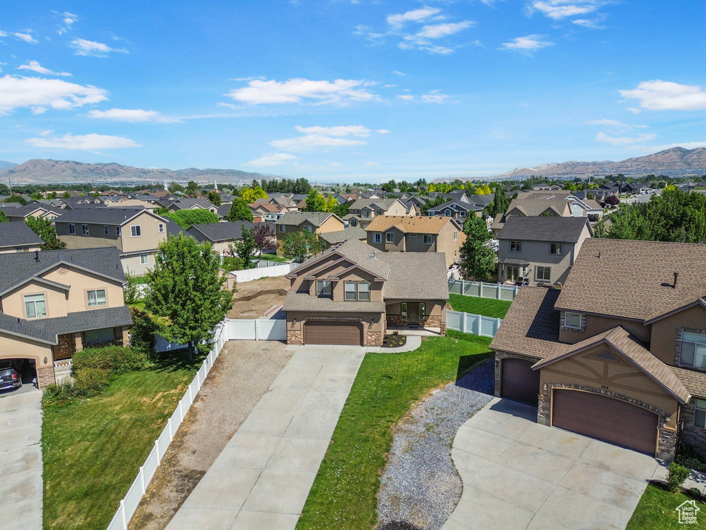 Aerial perspective of suburban area with a mountainous background