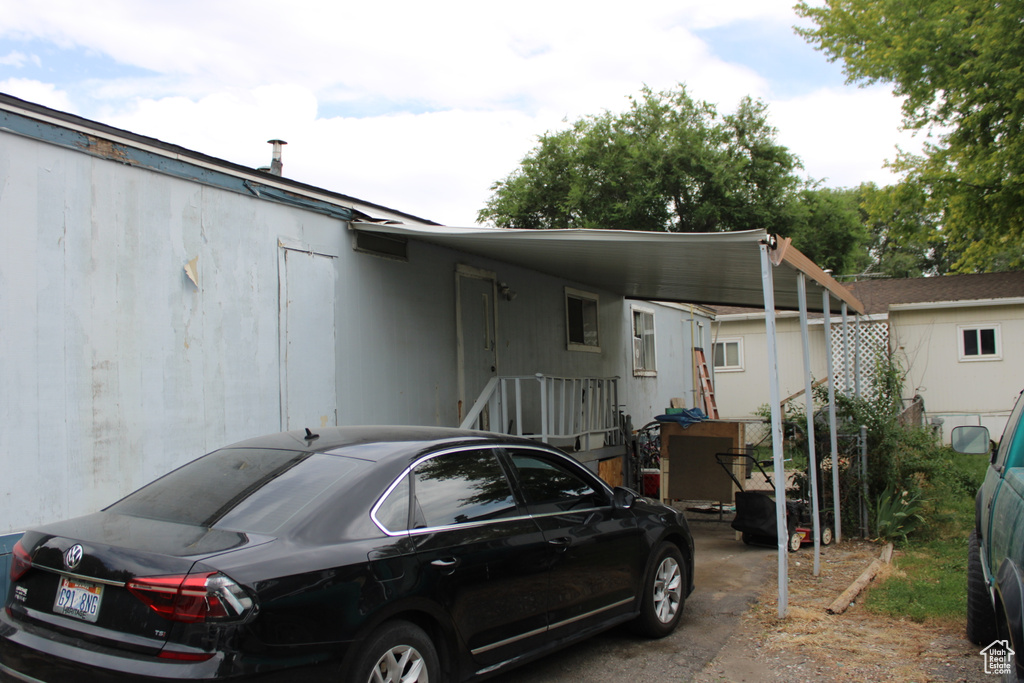 View of front of house with a carport