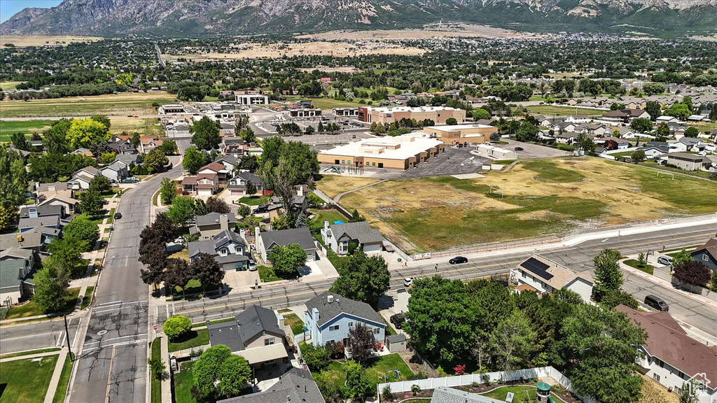 Aerial perspective of suburban area featuring a mountain backdrop