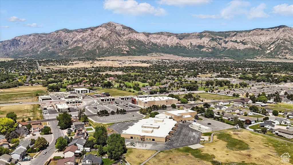Aerial perspective of suburban area featuring a mountainous background